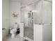 Bright bathroom showcasing marble tile, a glass walk-in shower, with modern fixtures and a toilet at 13805 Carryback Dr, Dade City, FL 33525