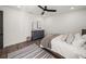 Bedroom featuring a comfy bed, a dresser, wood floors, and an area rug at 13805 Carryback Dr, Dade City, FL 33525