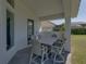This covered patio has seating, and provides a great place for relaxing and taking in the lovely scenery at 13805 Carryback Dr, Dade City, FL 33525