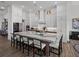 Large kitchen features a sizable island with barstool seating, stainless appliances, and sleek countertops at 13805 Carryback Dr, Dade City, FL 33525