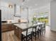 Modern kitchen offers a spacious island with seating, perfect for casual dining and entertaining at 13805 Carryback Dr, Dade City, FL 33525