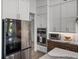Gourmet kitchen featuring stainless steel appliances and custom storage and countertops at 13805 Carryback Dr, Dade City, FL 33525