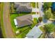 Aerial view of the property showcasing the home, yard, and surrounding neighborhood at 14417 Barley Field Dr, Wimauma, FL 33598