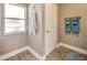 Bright bathroom featuring fresh white towels and a window for natural light and privacy at 14417 Barley Field Dr, Wimauma, FL 33598