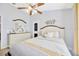 Bedroom with neutral decor, natural lighting, ceiling fan and modern dresser at 14417 Barley Field Dr, Wimauma, FL 33598
