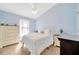 Bedroom featuring vaulted ceilings, white bedding, and a chest of drawers at 14417 Barley Field Dr, Wimauma, FL 33598