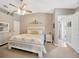 Tranquil main bedroom featuring a king bed, coordinated decor, and ample closet space at 14417 Barley Field Dr, Wimauma, FL 33598