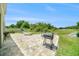 Backyard offers a spacious patio, hammock, grill, and picturesque water views at 18161 Hunters Meadow Walk, Land O Lakes, FL 34638