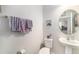 Clean half bath with a pedestal sink and decorative accents at 18161 Hunters Meadow Walk, Land O Lakes, FL 34638