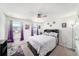 This bedroom boasts ample natural light, a ceiling fan and a modern design at 18161 Hunters Meadow Walk, Land O Lakes, FL 34638