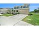 Welcoming two-story home featuring a two-car garage and a neatly manicured lawn at 18161 Hunters Meadow Walk, Land O Lakes, FL 34638