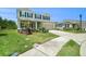 Beautiful two-story home with manicured lawn and driveway, complemented by lush landscaping at 18161 Hunters Meadow Walk, Land O Lakes, FL 34638