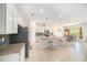 Open kitchen with an island, granite countertops, stainless steel appliances, and ample lighting at 18161 Hunters Meadow Walk, Land O Lakes, FL 34638