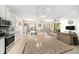 Spacious open kitchen featuring a large granite island and stainless steel appliances at 18161 Hunters Meadow Walk, Land O Lakes, FL 34638
