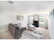Bright living room with comfortable seating, large windows, and natural light at 18161 Hunters Meadow Walk, Land O Lakes, FL 34638