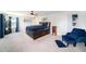 Large main bedroom with neutral carpet, ceiling fan, and an ensuite bath at 18161 Hunters Meadow Walk, Land O Lakes, FL 34638