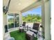 Covered patio with outdoor furniture, a ceiling and lush green backyard views at 18161 Hunters Meadow Walk, Land O Lakes, FL 34638
