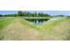 A scenic view of a private pond, enhancing the property's natural beauty and providing a tranquil setting at 18161 Hunters Meadow Walk, Land O Lakes, FL 34638