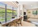 Bright dining room with modern lighting fixture and view into living area, creating a harmonious living space at 20347 Chestnut Grove Dr, Tampa, FL 33647