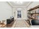 Elegant entryway featuring dark hardwood floors, stylish decor, and a view to the back patio at 20347 Chestnut Grove Dr, Tampa, FL 33647