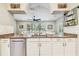 Open kitchen design showcasing stainless steel appliances, granite countertops, and seamless transition to living area at 20347 Chestnut Grove Dr, Tampa, FL 33647