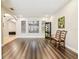 Spacious living room featuring hardwood floors, an arched doorway, and natural light at 20347 Chestnut Grove Dr, Tampa, FL 33647