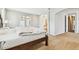 Bedroom featuring carpet, neutral paint and archway to en suite bathroom at 20347 Chestnut Grove Dr, Tampa, FL 33647