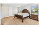 Bedroom featuring carpet, neutral paint, large windows and a dark wood dresser at 20347 Chestnut Grove Dr, Tampa, FL 33647