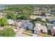 This image displays an aerial view of the property featuring a beautiful pool, lush landscaping, and a serene neighborhood at 206 Timberview Dr, Safety Harbor, FL 34695