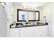 Bathroom with sleek vanity, dual sinks, and modern fixtures, offering both style and functionality at 206 Timberview Dr, Safety Harbor, FL 34695