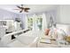 Spacious bedroom features stylish bed with convenient storage, adjacent vanity, and outdoor views at 206 Timberview Dr, Safety Harbor, FL 34695