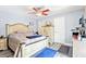 Bedroom with ceiling fan, neutral decor, and wood-look floors at 206 Timberview Dr, Safety Harbor, FL 34695