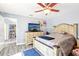 This bedroom features blue walls and a wood-look floor at 206 Timberview Dr, Safety Harbor, FL 34695