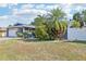 Charming single-story home with a brick driveway and walkway leading to the front door at 206 Timberview Dr, Safety Harbor, FL 34695