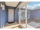 Inviting front entry with tile flooring and a screen door for added comfort and ventilation at 206 Timberview Dr, Safety Harbor, FL 34695