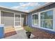 Inviting front entry with tile flooring and a screen door for added comfort and ventilation at 206 Timberview Dr, Safety Harbor, FL 34695