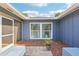 Inviting front entry with tile flooring and a screen door for added comfort and ventilation at 206 Timberview Dr, Safety Harbor, FL 34695