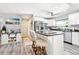 Kitchen featuring white cabinetry, stainless steel appliances, and a kitchen island with bar stool seating at 206 Timberview Dr, Safety Harbor, FL 34695