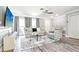 Bright living room features modern gray decor, stylish furniture, and wood-look flooring at 206 Timberview Dr, Safety Harbor, FL 34695