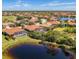 Community aerial view featuring clay tile roofs, community lakes and golf course at 218 Pesaro Dr, North Venice, FL 34275