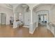 Expansive foyer with soaring ceilings, stylish columns, and wood floors, creating a welcoming atmosphere at 218 Pesaro Dr, North Venice, FL 34275