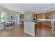 Bright kitchen with granite countertops, modern appliances, and an adjacent breakfast nook area at 218 Pesaro Dr, North Venice, FL 34275