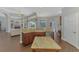 Open-concept kitchen with island overlooking living area, featuring stainless appliances and granite counters at 218 Pesaro Dr, North Venice, FL 34275