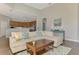 The living room has high ceilings and flows to the kitchen at 218 Pesaro Dr, North Venice, FL 34275