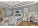 Spacious main bedroom boasts hard floors, a cozy seating area, and a full workstation at 218 Pesaro Dr, North Venice, FL 34275