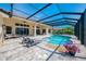 Stunning pool area, perfect for outdoor entertaining with lounge area and beautiful landscaping at 218 Pesaro Dr, North Venice, FL 34275