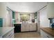 Traditional kitchen design featuring white cabinets, black dishwasher, and a garden view window at 219 Park S Cir, Dunedin, FL 34698