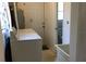 Functional laundry area features a washer and dryer, utility sink, and a convenient water heater at 219 Park S Cir, Dunedin, FL 34698