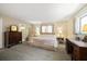 Serene main bedroom with cozy decor and an ensuite bathroom with plenty of natural light at 219 Park S Cir, Dunedin, FL 34698