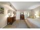 Spacious main bedroom with a dressing area, well-lit, and ensuite bathroom at 219 Park S Cir, Dunedin, FL 34698